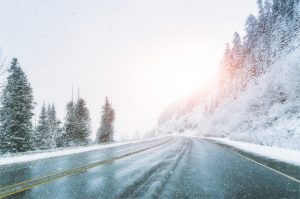 scenic-view-of-empty-road-with-snow-covered-landscape-while-snowing-in-winter-season