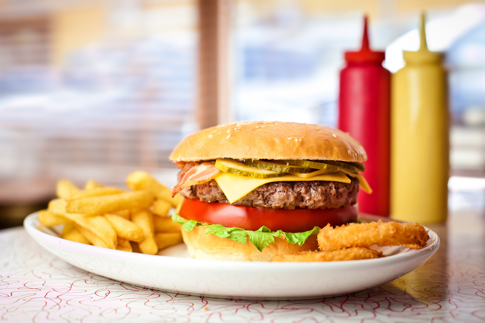 Close up of the fresh hamburger with french fries