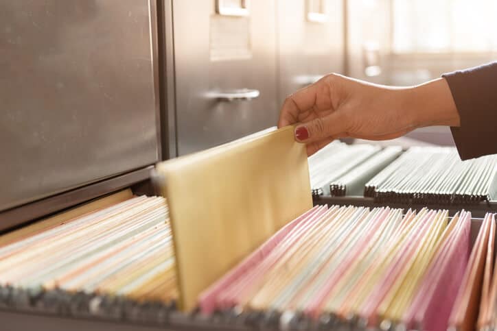 woman looking through records in an office